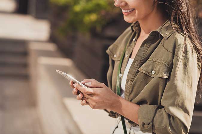 woman-smiling-at-phone